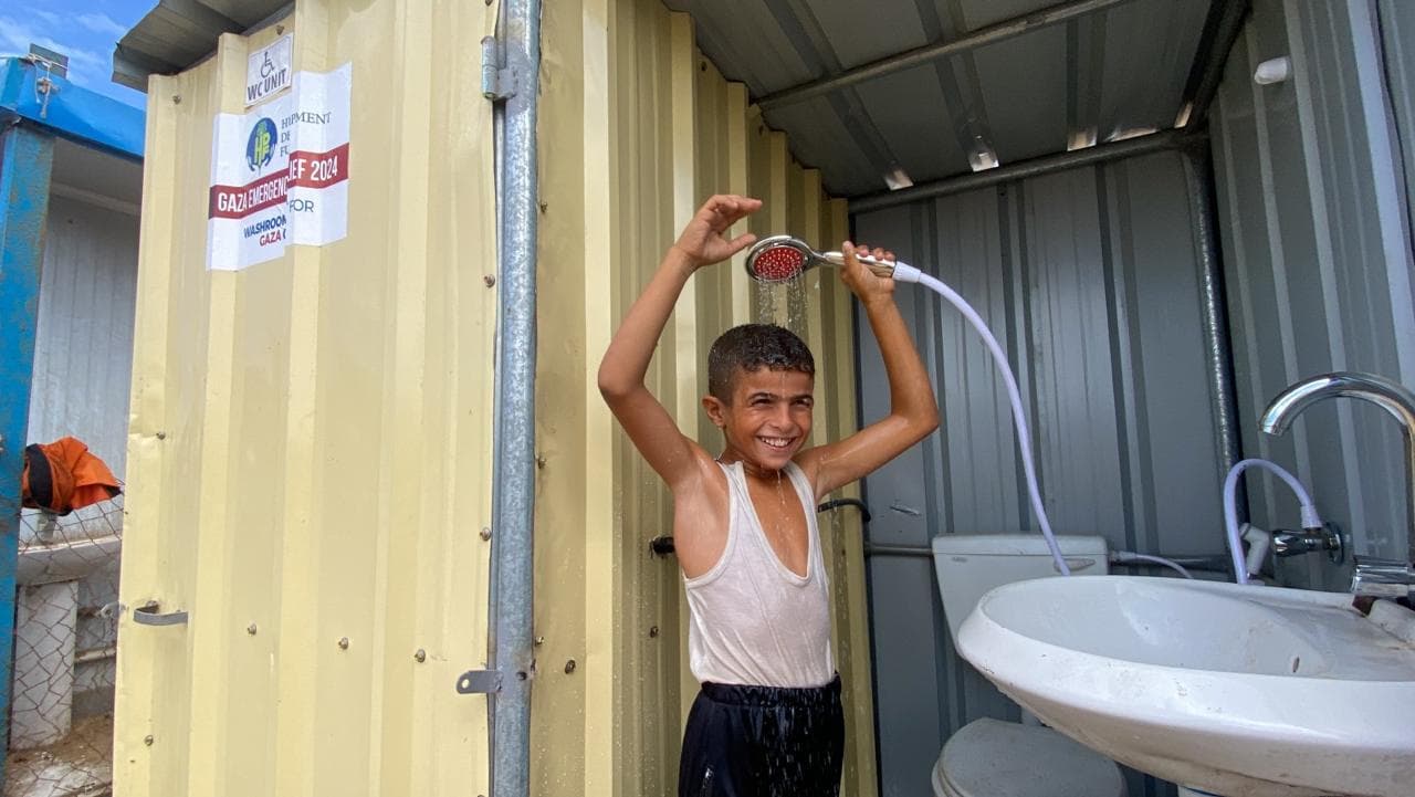Aid worker walking through rebuilding site